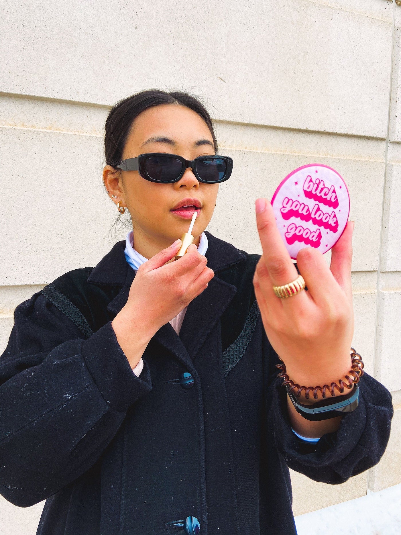 small pink pocket mirror branded with "bitch you look good" to remind you 
