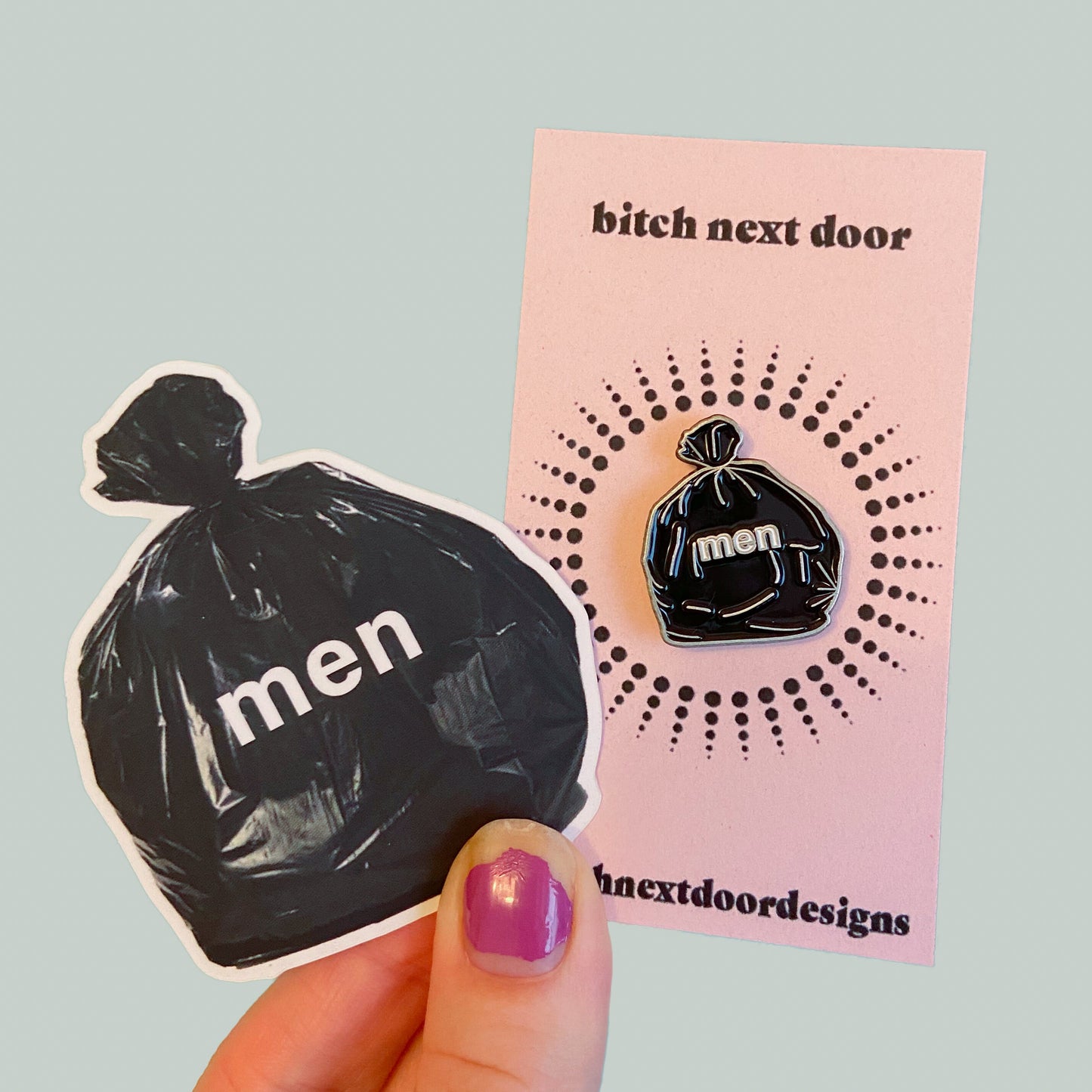 Our signature men are trash product now in a sticker and pin 